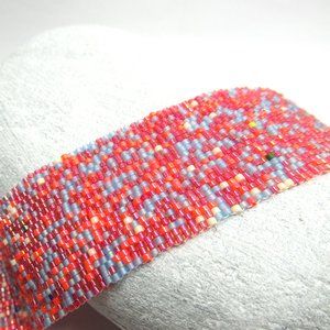 Peyote stitched bracelet with purple button